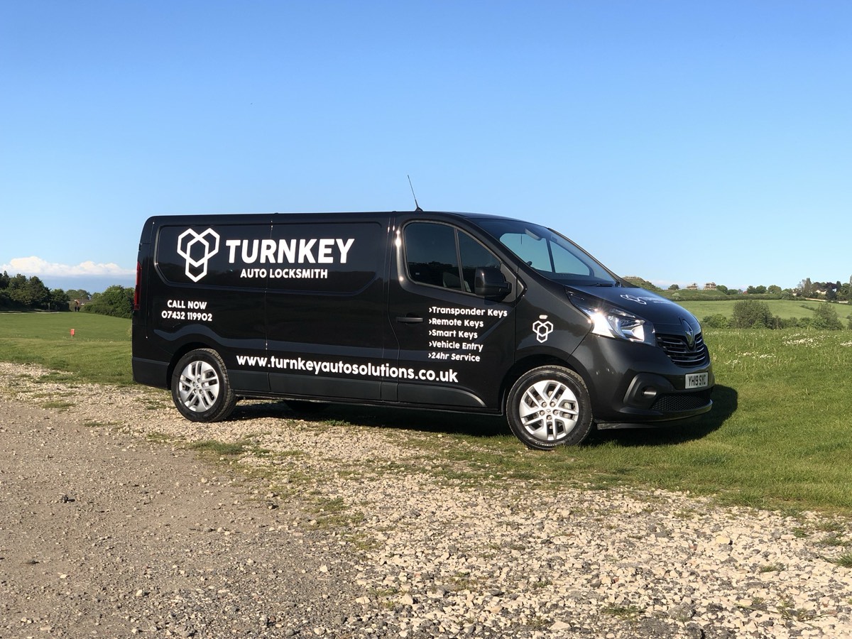 Turnkey Auto Solutions van parked in the countryside